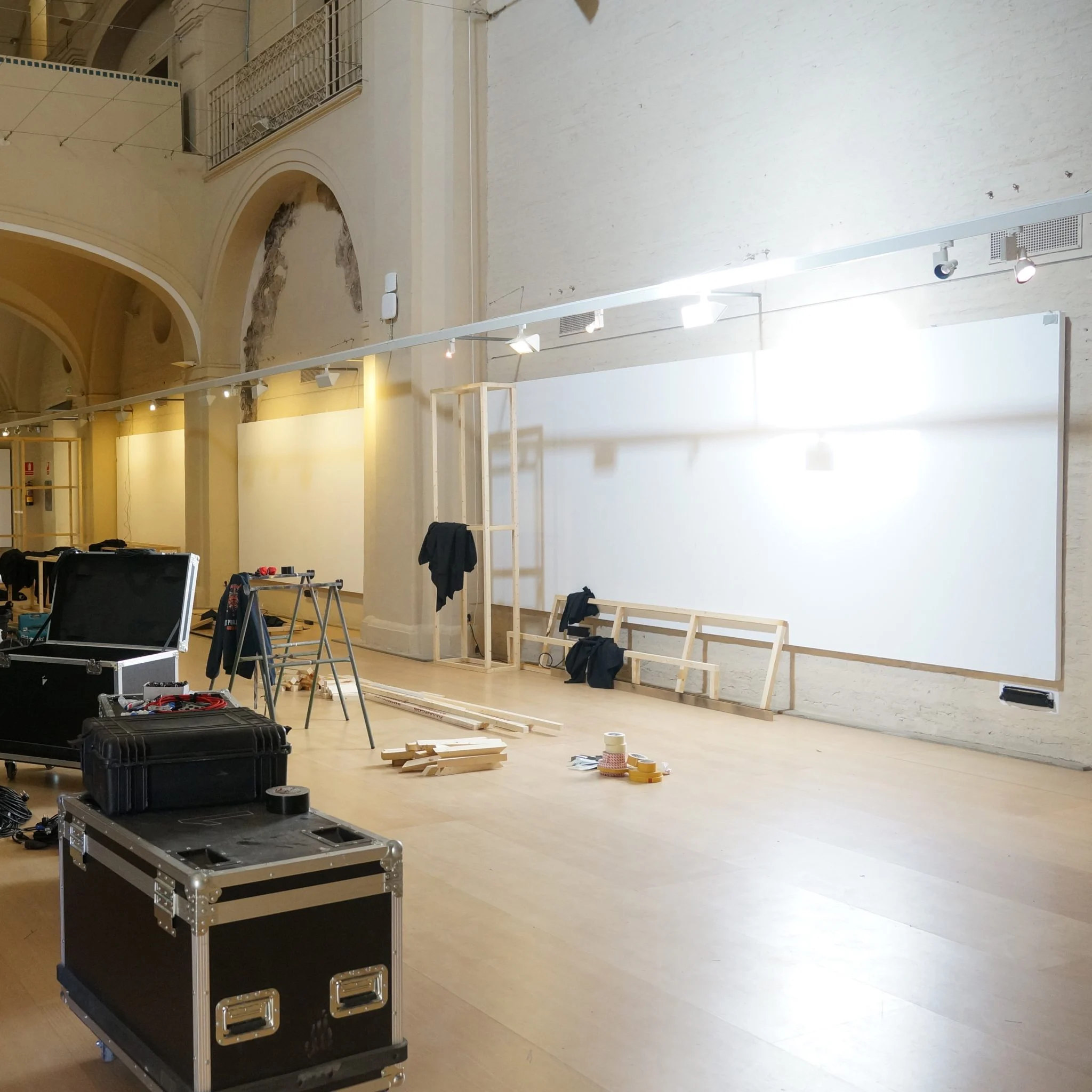 A large hall being set up with trestles and equipment