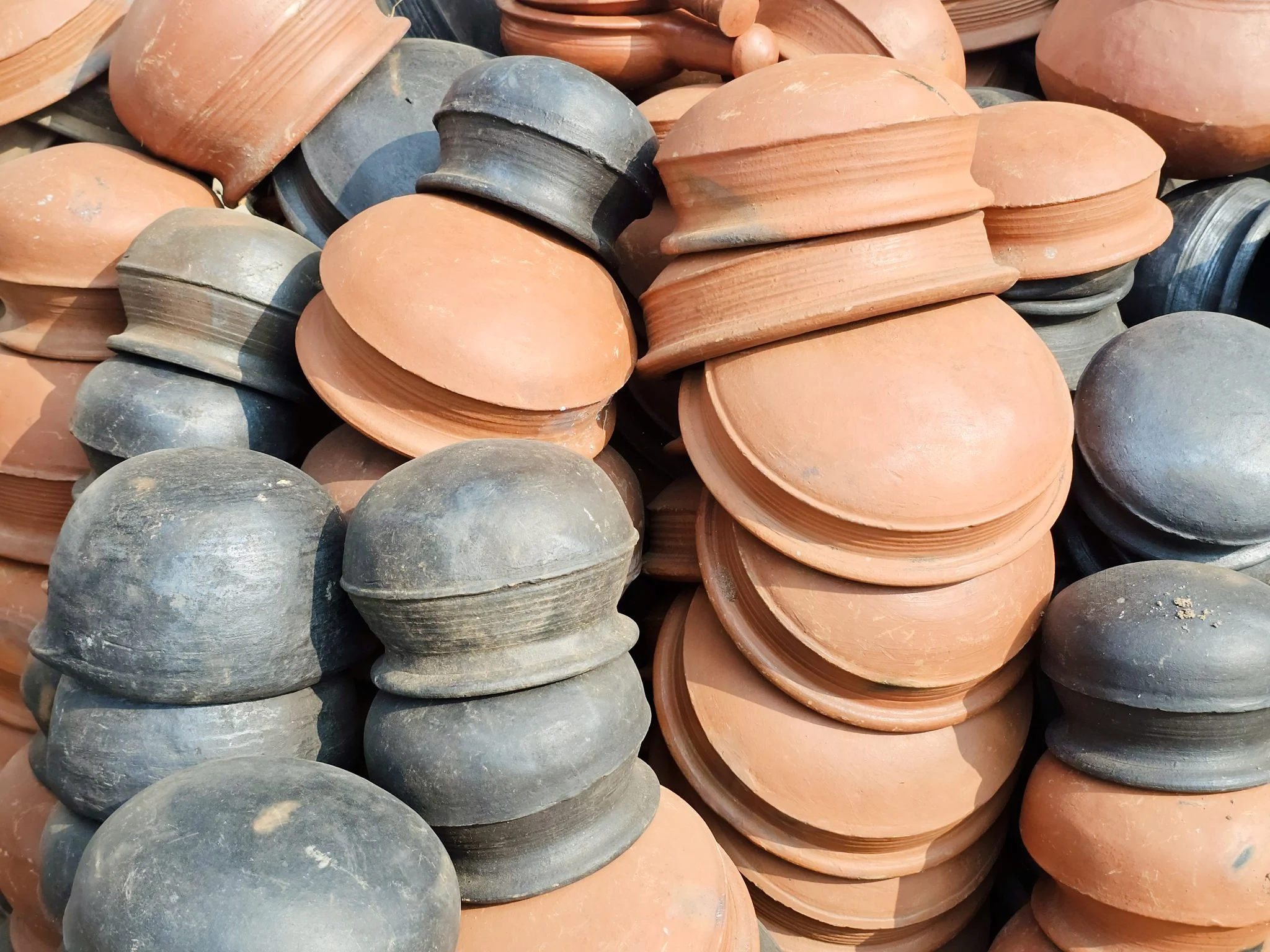 Stacks of terracotta and blackened clay pots